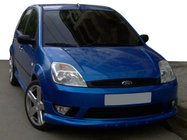 Ford Fiesta 2002–2008 Priekšējā bampera lūpa 2002-2005 (uzlika, krāsošanai) foto 1