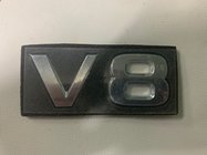Nissan Patrol Y62 2010–2024 V8 emblēma foto 1