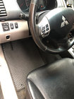 Mitsubishi Pajero Sport 2008–2015 EVA auto paklājiņi (melni) foto 1