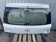 Toyota Land Cruiser 200 2007–2021 Bagāžnieka vāka augšējā daļa 2016+ balta (lietota, oriģināls) foto 1