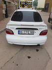 Hyundai Accent 1994–1999 Spoileris Meliset (krāsošanai) foto 2
