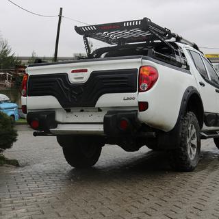 Plastmasas uzlika bagāžnieka vākam Mitsubishi L200 2006–2015 foto 2