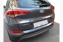 Hyundai Tucson TL 2016–2021 Izpārdošana Apmales līste virs numura zīmes (2015–2018, augšējā, plata, nerūsējošais tērauds) foto 1