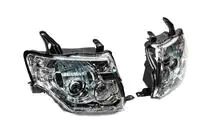 Mitsubishi Pajero Wagon IV 2006–2021 OEM priekšējie lukturi (2 gab.) foto 2