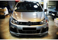 Volkswagen Golf 6 2008–2014 Priekšējā lip uzlika DPT V-1 (melns spīdīgs) foto 1