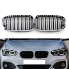 BMW 1. sērija F20/F21 2011–2019 M-Look priekšējā reste (2015-2019, melna spīdīga ar hromētu apmali) foto 2
