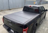 Toyota Hilux 2015– 4 sekciju salokāms kravas kastes pārsegs foto 1