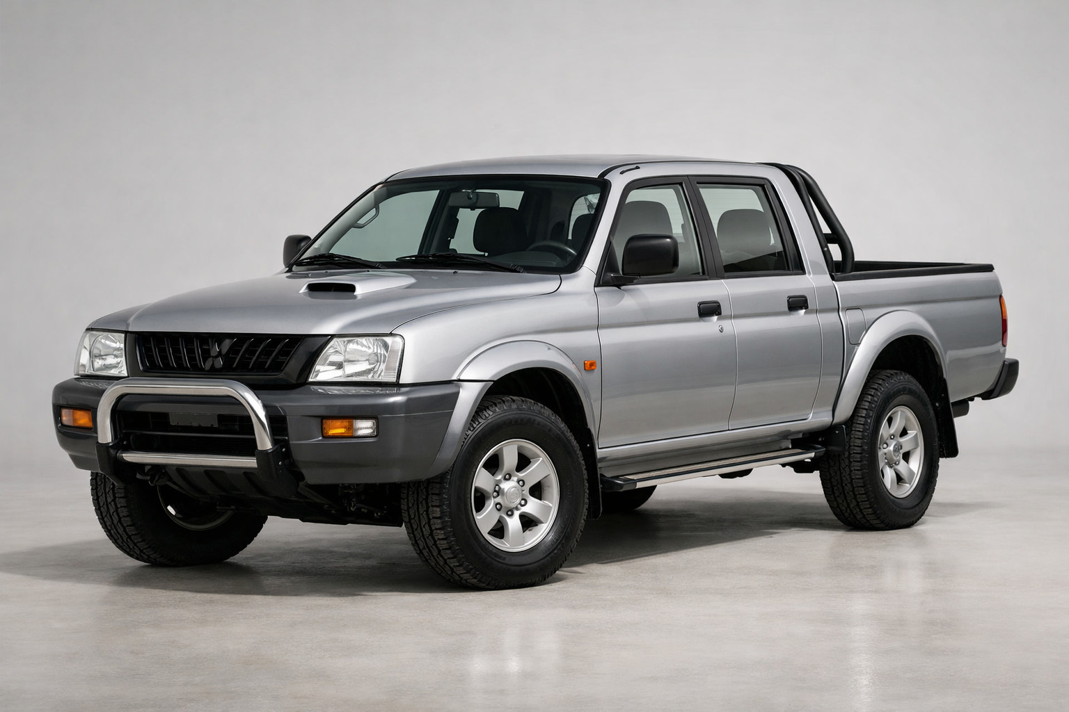 Mitsubishi L200 1996–2006 apskats: vecās skolas pikaps bez spozmes
