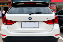 BMW X1 E84 2009–2015 DPT M-Style spoilers (melns spīdīgs) foto 1