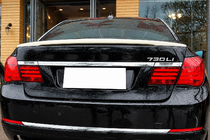 BMW 7. sērija F01/F02 2008–2015 DPT spoileris (spīdīgi melns) foto 1