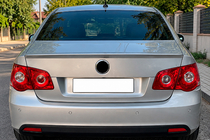 Volkswagen Jetta 2006–2011 DPT spoileris (spīdīgi melns) foto 1