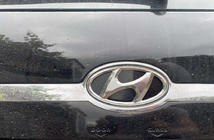 Hyundai Tucson JM 2004– Emblēma (pašlīmējoša uzlīme, 125 mm (65 mm)) foto 1