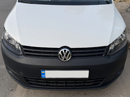 Volkswagen Caddy 2010–2015 Priekšējā emblēma 1T0 853 601E foto 2