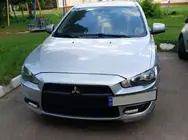 Mitsubishi Lancer X 2008– Numura zīmes turētājs (plastmasa) Matēts melns foto 3