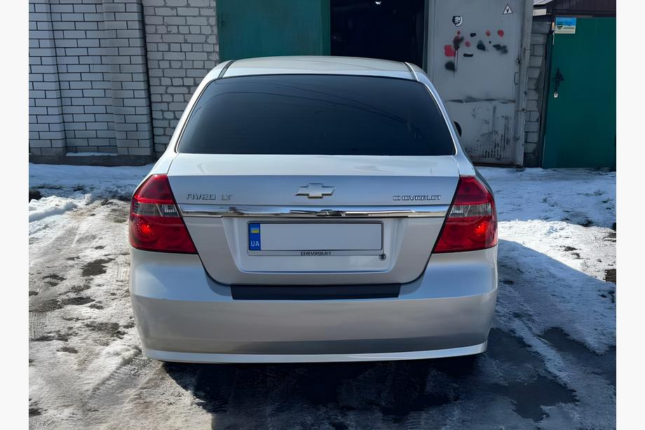 Chevrolet Aveo T250 2005–2011 Aizmugurējā bampera uzlika ar ieloku, plastmasa Matēts, sedans (4 durvis) Image