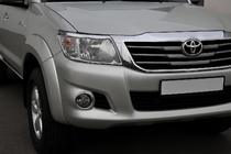 Toyota Hilux 2006–2015 Hromētas lukturu uzlikas (2 gab., plastmasa) foto 1