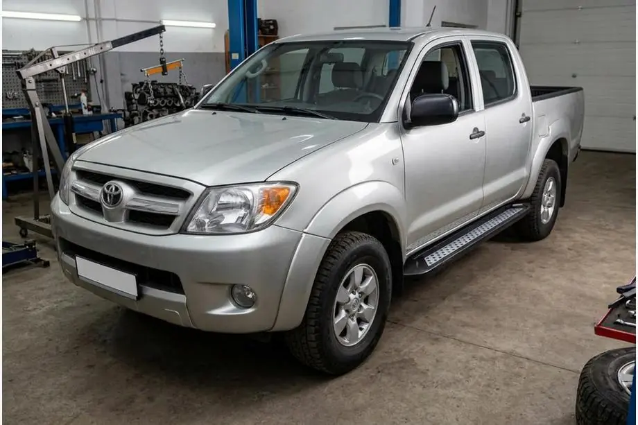 Toyota Hilux 2006–2015 Sānu sliekšņi New Vision Black (2 gab., alumīnijs) Foto 1