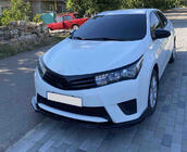 Toyota Corolla 2013–2019 Priekšējā bufera lūpas uzlika (melna) foto 1