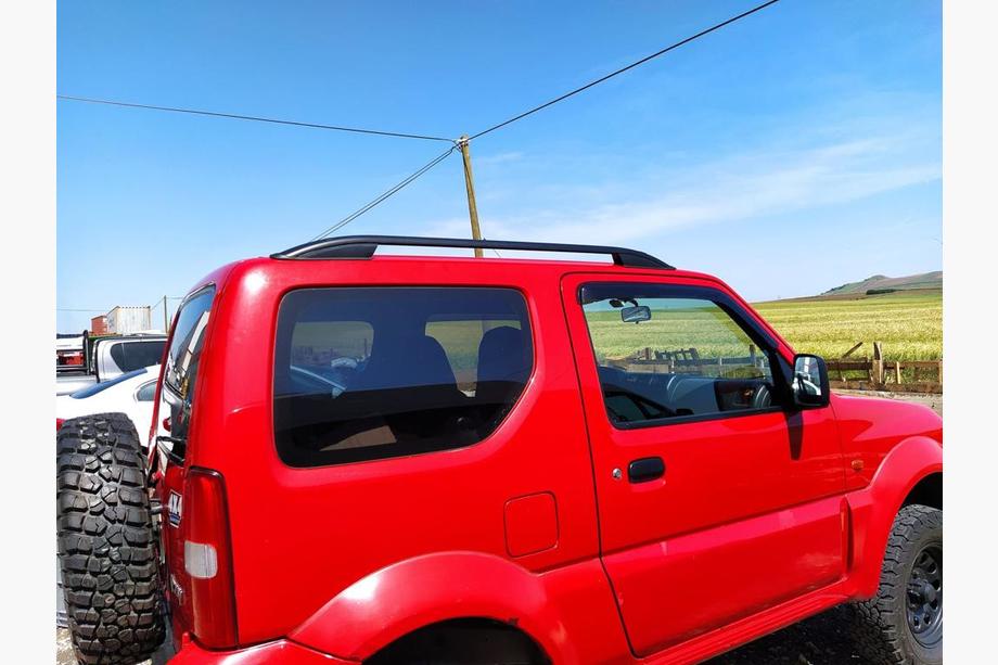 Suzuki Jimny 1998–2018 Jumta reliņi Skyport (melni) Image