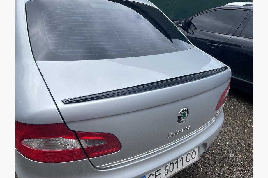 Skoda Superb 2009–2015 LIP spoileris (Sunplex, melns) (115,8 cm x 6,3 cm) Image