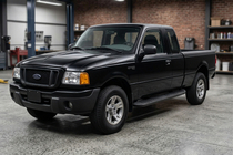 Ford Ranger 2002–2006 Sānu kāpšļi Tayga Black (2 gab., alumīnijs) foto 1